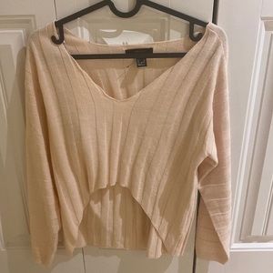 Casual top with a glimpse of pink colour.